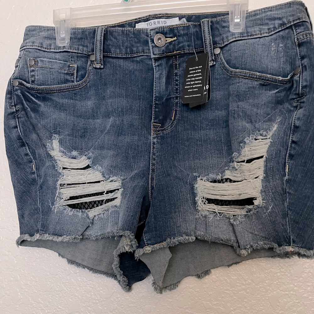 Torrid jean shorts ripped with fish net